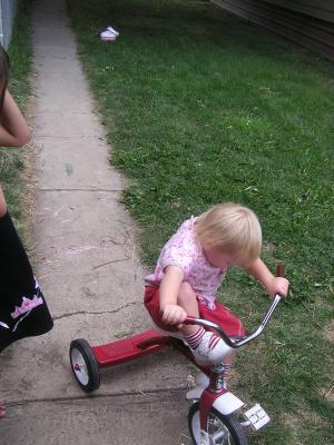 Sarah on her tricycle