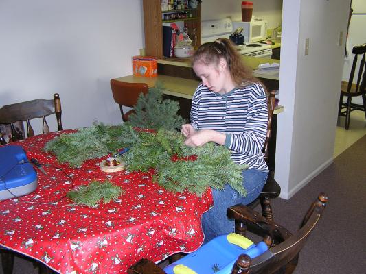 Katie makes a Christmas wreath.