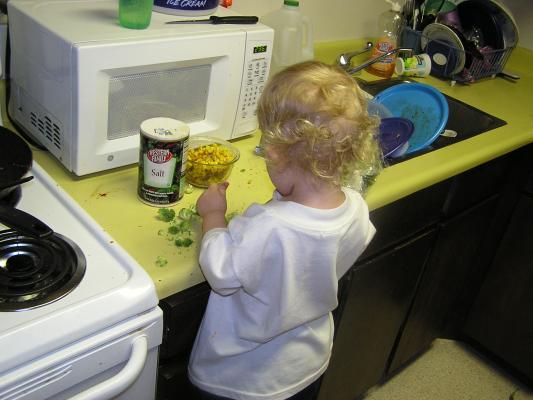 Noah eats brocolli for his bedtime snack.