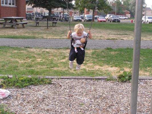 Noah swings with his baby.