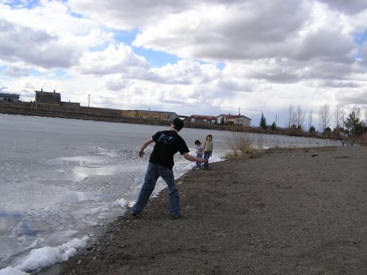 Mike throws some rocks into the lake.