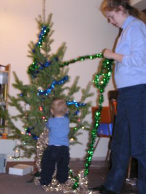 Noah is an expert at decorating the tree.