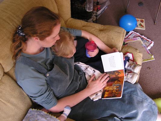 Katie reads the Easter book to Noah.