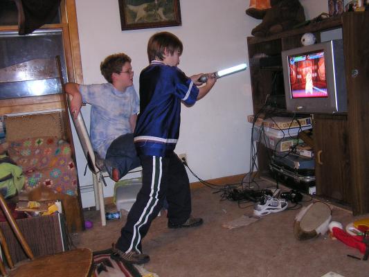 Darth Patrick swings his light saber.