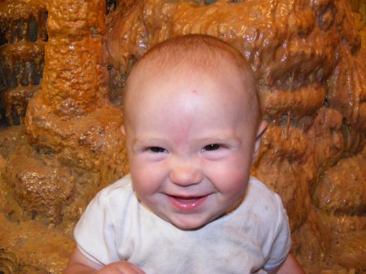 Happy baby in a cave.