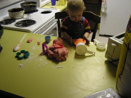 We're cooking with some play dough and cookie cutters.