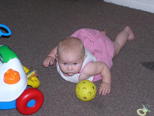 Sarah goes after the yellow ball.