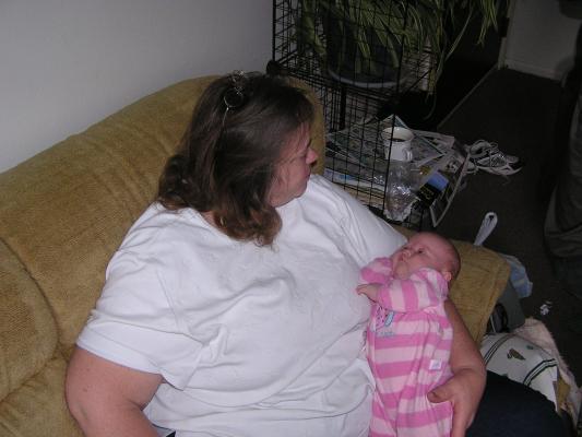 Mary holds her new granddaughter.