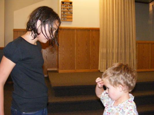 Noah about to hug Malia at her baptism.