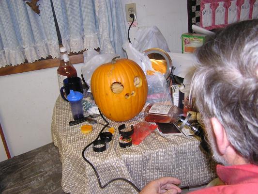 Walt carves a pumpkin with nothing but a drill.