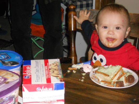 Joshua with cake and ice cream on his first birthday. 