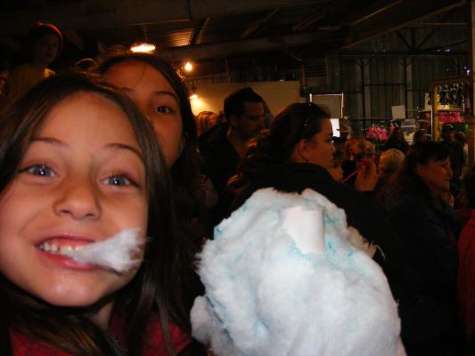 Andrea and Malia eat cotton candy at the circus.