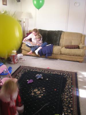 Sarah's playing with the balloon. Noah listens toa story