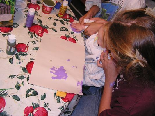 Today we painted on paper. Sarah made hand prints.