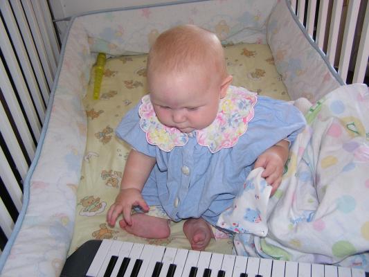 Sarah plays with the piano.