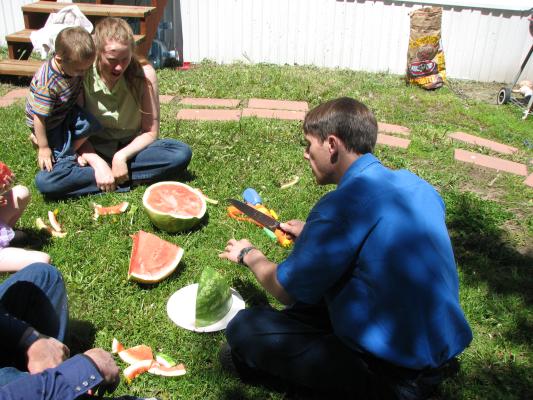 David, Noah and KAtie eat watermelon