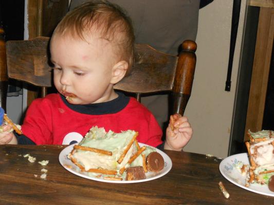 Joshua eats his first birthday cake 