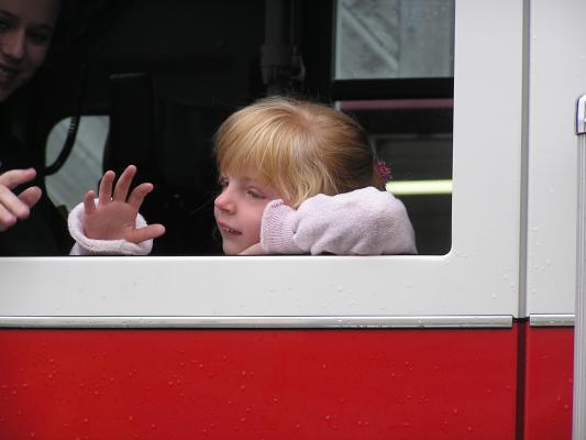 The Belgrade Fall Festival Parade.
Little girl in the firetruck waves to the crowd.