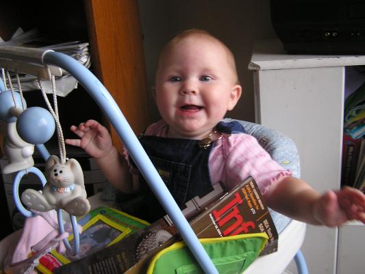 Sarah is very happy that she can get into stuff from her walker.
