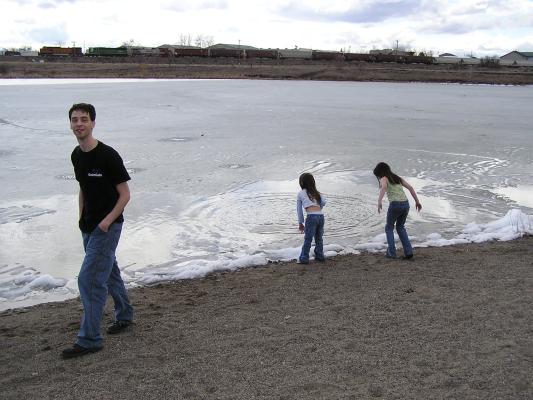 Let's throw rocks through the ice/slush on the lake.