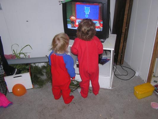 Noah and Sarah watch Super Why in pajamas