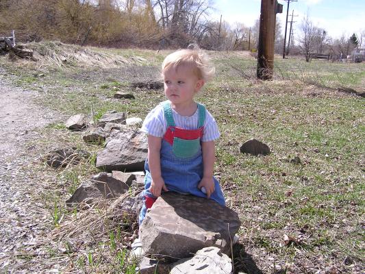 Noah looks around at the other rocks and sticks.