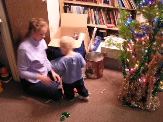 Noah gets some ornaments from mommy.