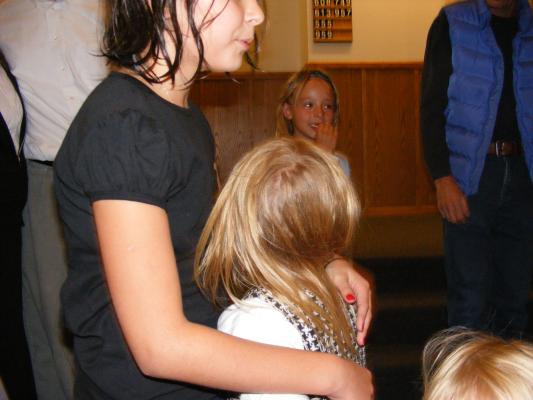 Karla hugs Malia after Malia gets baptized.