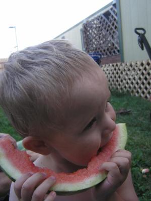 Noah eats some watermelon.