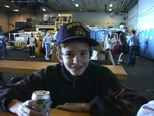 Matthew drinking a beer on the USS Car Vincent