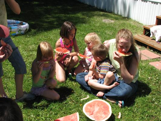 Karla, Andrea, Sarah, Noah and KAtie enjoy watermellon.