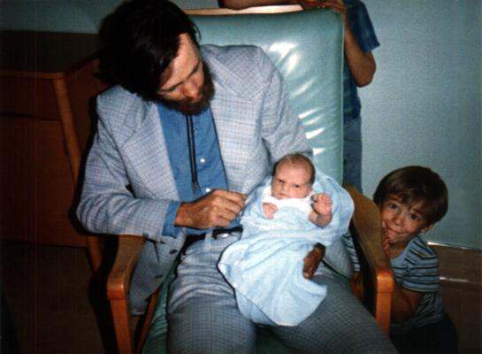 Dad with baby Matthew and Jim peeking