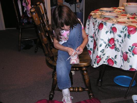 What a smart girl! Andrea can tie her own shoes.