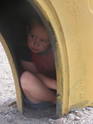 Noah in a tire at the park