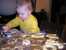 Noah helped cut out lots of cookies. thumb