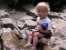 Noah plays in the water at the top of Ousel Falls. thumb