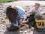 Noah and Andrea play in the sand thumb