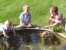 Sarah, Noah and another boy admire the goldfish. thumb