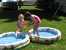 Andrea and Sarah play in some pools in Andrea's yard. thumb