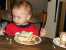 Joshua eats his first birthday cake thumb