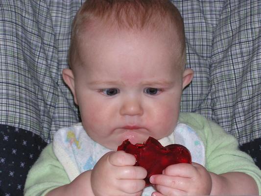Noah eats red heart jello
