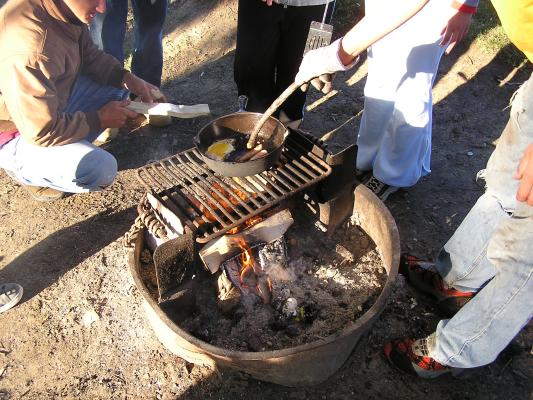 Christian Student Fellowship campout.
Cooking eggs for breakfast.