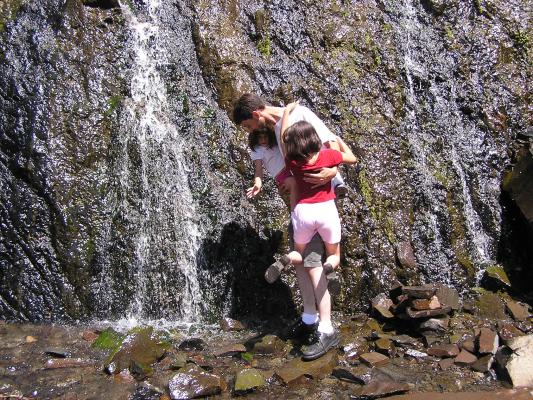 Myke gets his girls next to the waterfall.