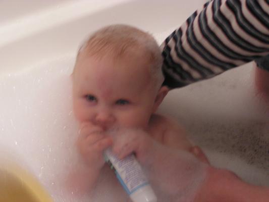 Sarah takes a bubble bath.