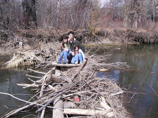 Andrea, Mike and Malia on the beaver dam.