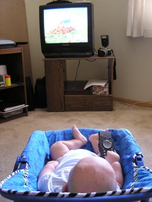Babies aren't supposed to have the remote
until they're two...except   for me.