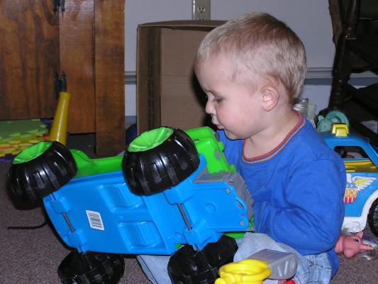 Noah plays with cars.