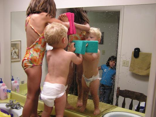 Andrea and Noah wash the mirror.