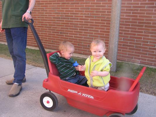Noah and Sarah ride in the wagon. 
They are wearing green for St. Patrick's Day.
