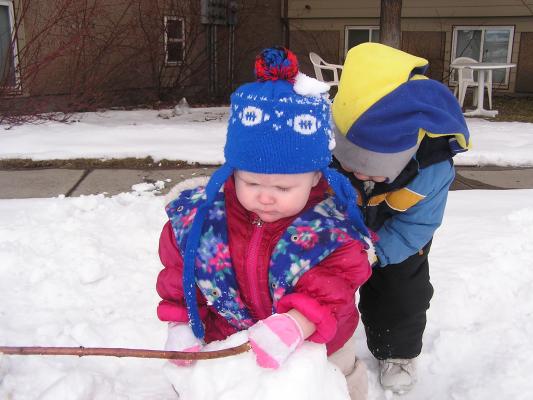 Sarah and Noah play in the snow.